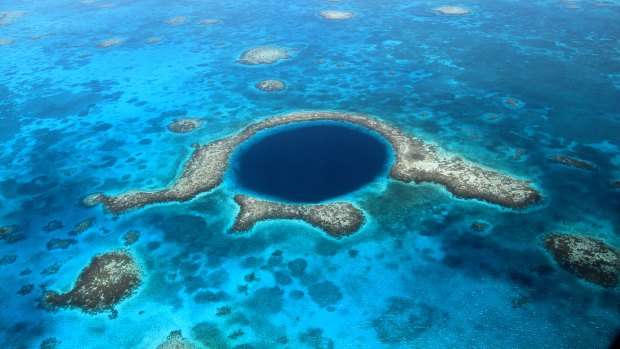 The Great Blue Hole, a collapsed underwater cave system at Lighthouse Reef in Belize,.