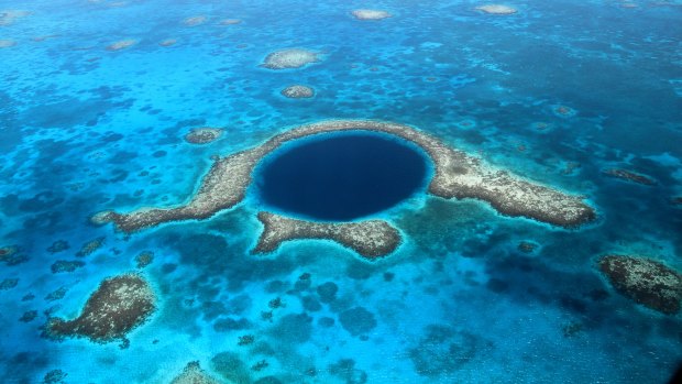 The Great Blue Hole, a collapsed underwater cave system at Lighthouse Reef in Belize,.