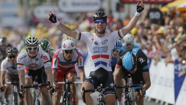 Britain's Mark Cavendish crosses the finish line ahead of Edvald Boasson Hagen of Norway, right and second place, and Andre Greipel of Germany, left and fourth place, to win the fifth stage in Marseille.