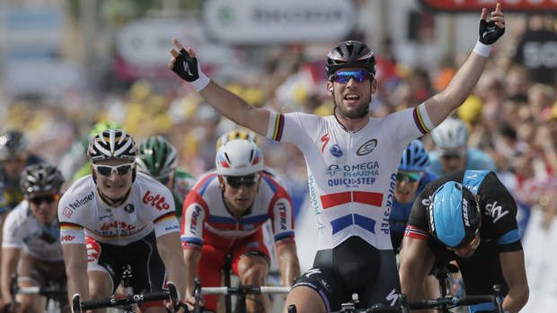 Britain's Mark Cavendish crosses the finish line ahead of Edvald Boasson Hagen of Norway, right and second place, and Andre Greipel of Germany, left and fourth place, to win the fifth stage in Marseille.