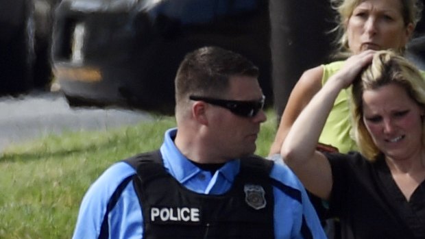 Police surround the Capital Gazette building after the shooting. 