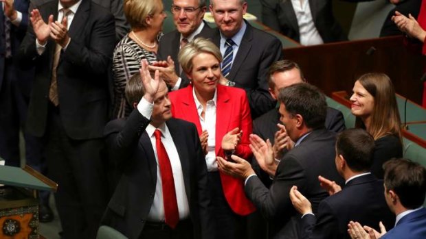 Opposition Leader Bill Shorten acknowledges applause from the public gallery after delivering the Budget reply. Photo: Alex Ellinghausen