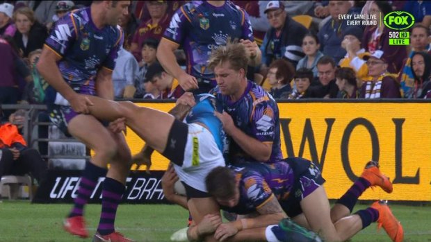 Paradox: Smith's retirement from rep footy comes after he was suspended for this 'wishbone' tackle.
