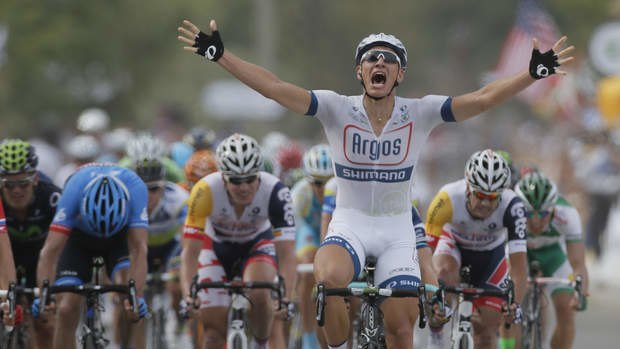 Marcel Kittel of Germany celebrates as he crosses the finish line to win the first stage of the Tour de France 2013.