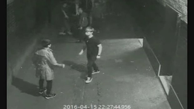 Jeremy Hu is seen in the CCTV footage wearing a jacket, with the unidentified teenager in a black T-shirt. 