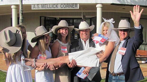 Kahla Pike, in the veil, caught up with Bob Katter and Katter's Australian Party's senate candidate James Blundell on the campaign trail in Innisfail today. Some members of the bridal party (from left) are younger sister Katrelle Pike, cousin Shannae Rose, and friend Hanne Lillevik.