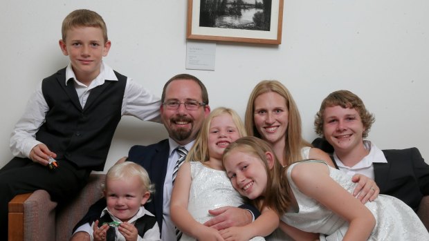 AMEP Senator Ricky Muir and partner Kerrie-Anne, together with their five children (L-R) William, Tristan, Tarja, Phoenix and Dylan in his office in Canberra on Thursday.