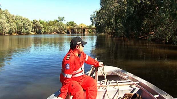 SES and National Parks staff search for the body of a man who was taken by a crocodile on Mary River.