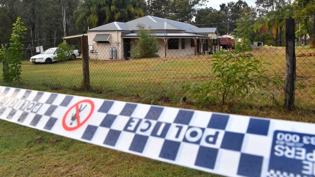 Police tape is seen at a house in Buccan where police had been investigating a missing person.
