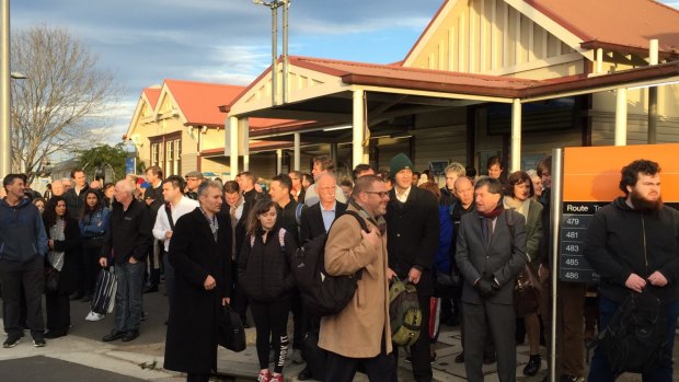Hundreds of stranded commuters wait at Sunbury station for buses after train services were severely disrupted this morning.