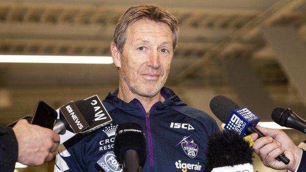 Decisions to make: Storm coach Craig Bellamy speaks to the media at Melbourne Airport.