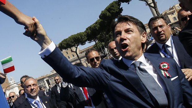 Italian Prime Minister Giuseppe Conte is greeted by citizens on during celebrations for Italy's Republic Day.
