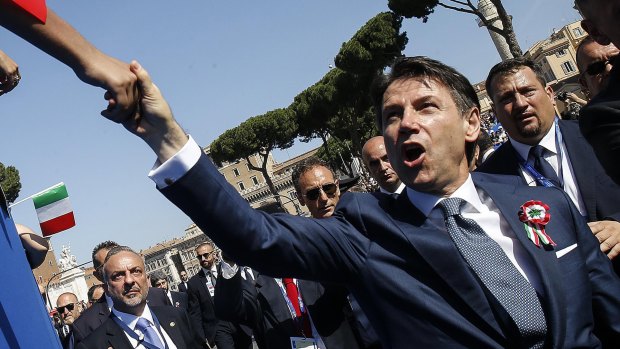 Italian Prime Minister Giuseppe Conte is greeted by citizens on during celebrations for Italy's Republic Day.