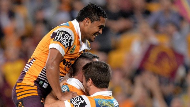 BRISBANE, AUSTRALIA - JULY 24: Corey Parker of the Broncos celebrates scoring a try with team mates Ben Hunt and Anthony Milford during the round 20 NRL match between the Brisbane Broncos and the Gold Coast Titans at Suncorp Stadium on July 24, 2015 in Brisbane, Australia.  (Photo by Bradley Kanaris/Getty Images)