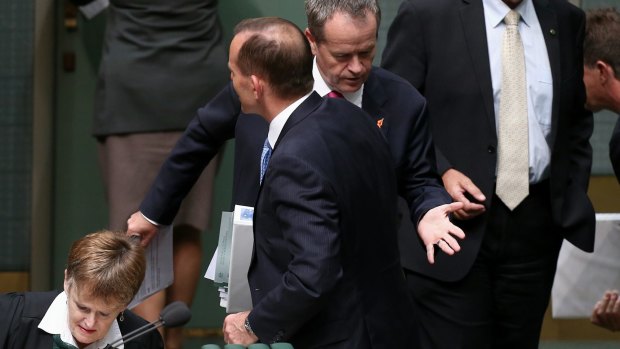 Prime Minister Tony Abbott and Opposition leader Bill Shorten after a division at Parliament House on Thursday.