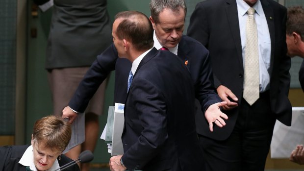 Prime Minister Tony Abbott and Opposition leader Bill Shorten after a division at Parliament House on Thursday.