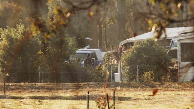 Forensic police continue to search the Osmington property where seven people were found dead.