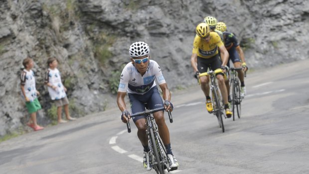 Back and forth: Quintana, wearing the best young rider's white jersey, breaks away from Froome.