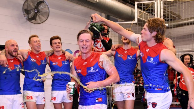 Spargo is drenched by his teammate Jayden Hunt while celebrating his first win on Sunday. 