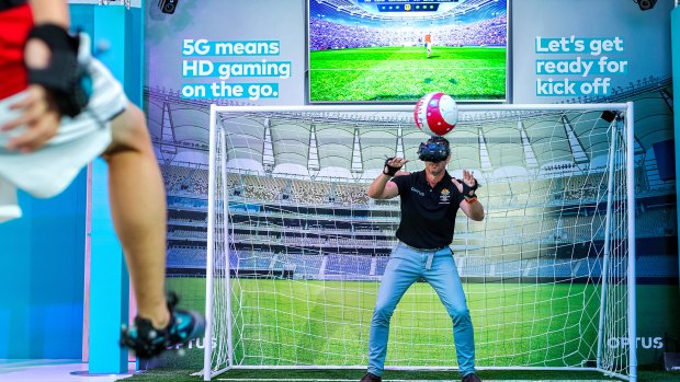 5G's low latency allows you to stop a real soccer ball when wearing a Virtual Reality headset, relying on signals relayed via the Optus 5G network.