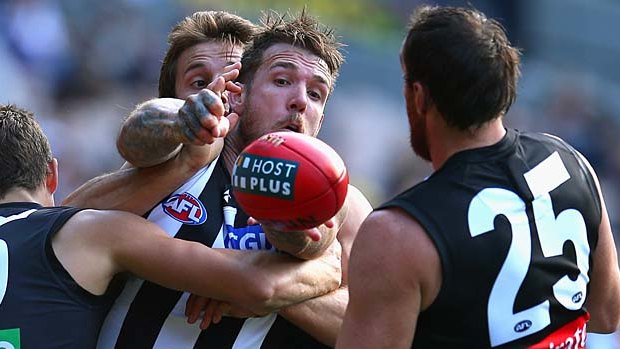 Dane Swan gets some close attention during his 200th AFL game.