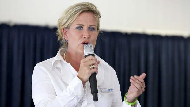 The LNP's Kerri-Anne Dooley distanced herself from the former state MP at the Redcliffe candidates' forum.