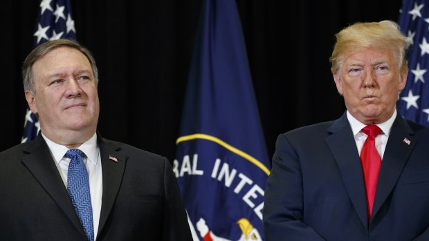 US President Donald Trump stands with Secretary of State Mike Pompeo 