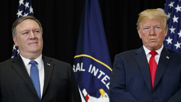 US President Donald Trump stands with Secretary of State Mike Pompeo 