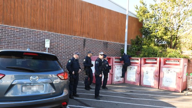 Police conduct a search at the Balmain Woolworths car park last week.