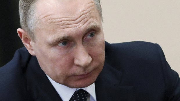 Russian President Vladimir Putin's government is accused of waging cyber war after Syrian strikes. 