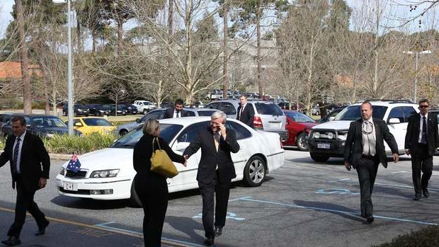 Prime Minister Kevin Rudd is greeted by a member of his advance team on arrival at the CSIRO Australian Resources Research Centre in Perth on Friday.