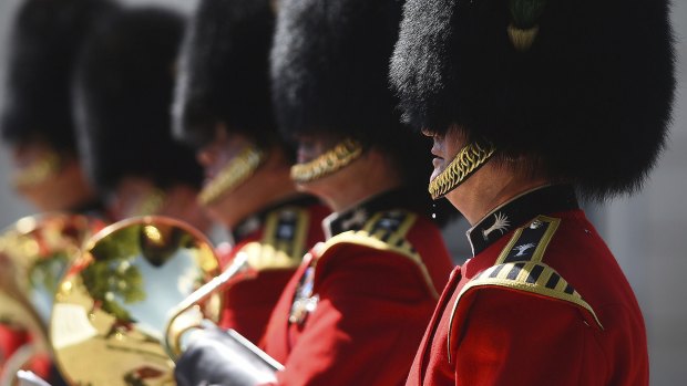 A bead of sweat falls from a member of The Queen's Guard as he takes part in the Changing the Guard ceremony on Monday. 