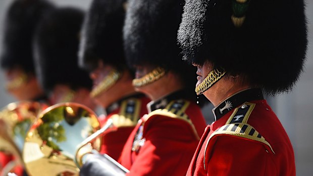 A bead of sweat falls from a member of The Queen's Guard as he takes part in the Changing the Guard ceremony on Monday. 