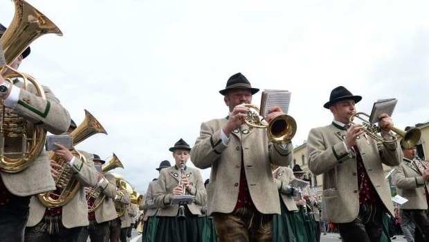 Top brass: A traditional Bavarian brass band takes part in a parade at the Oktoberfest festival in Munich.