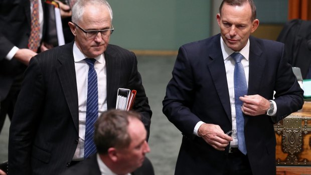 Communications Minister Malcolm Turnbull and Prime Minister Tony Abbott leave question time on Wednesday.