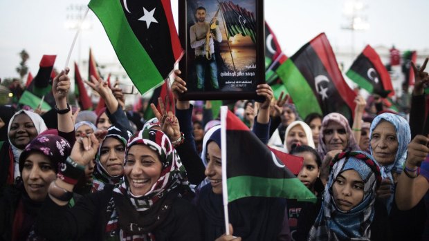 Women in Tripoli celebrate the news of Muammar Gaddafi's capture and death in the town of Sirt in October 2011.