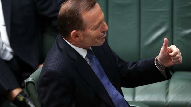 Prime Minister Tony Abbott gives the thumbs-up to Deputy Prime Minister Warren Truss during Question Time. Photo: Alex Ellinghausen