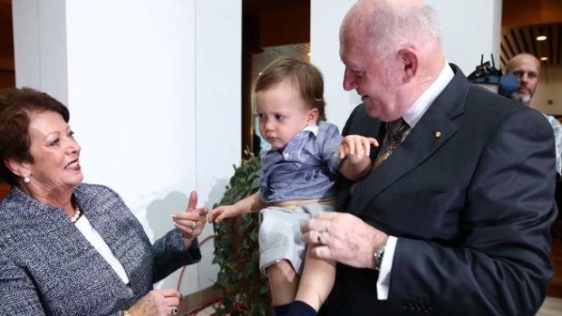 His Excellency General the Honourable Sir Peter Cosgrove AK MC (Retd) the Governor-General of the Commonwealth of Australia, with his wife Lynne and their 18-month-old grandson Max, during a reception in the Members' Hall. Photo: Alex Ellinghausen