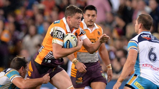 BRISBANE, AUSTRALIA - JULY 24:  Corey Oates of the Broncos looks to take on the defence during the round 20 NRL match between the Brisbane Broncos and the Gold Coast Titans at Suncorp Stadium on July 24, 2015 in Brisbane, Australia.  (Photo by Bradley Kanaris/Getty Images)