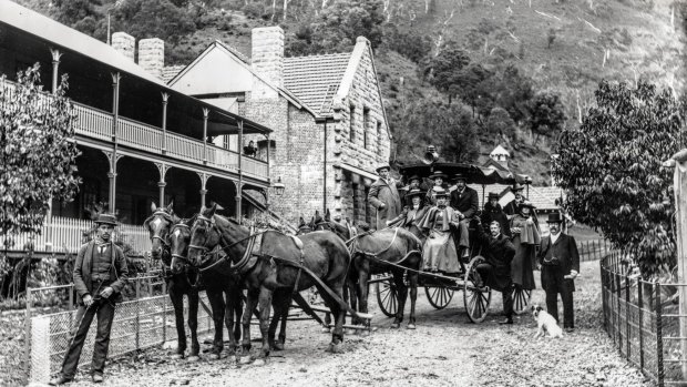 Coach and horses outside Caves House. 