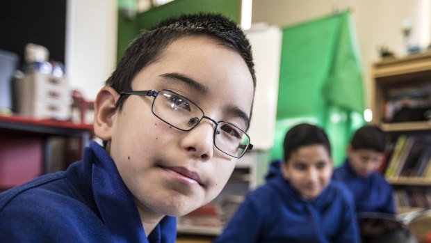 Areyan Akbari, 11, works with his classmates brain storming ideas at Merrylands East Primary School, which partners with Atlassian and the Museum of Contemporary Art to give kids a real taste of the world of work.