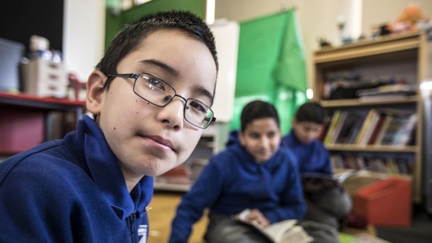 Areyan Akbari, 11, works with his classmates brain storming ideas at Merrylands East Primary School, which partners with Atlassian and the Museum of Contemporary Art to give kids a real taste of the world of work.