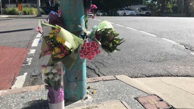 Flowers were laid at the Ann Street intersection where a woman was killed last month.