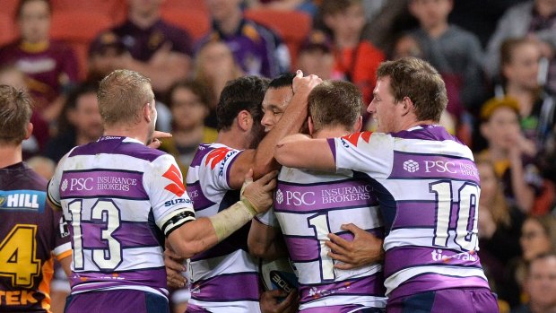 BRISBANE, AUSTRALIA - SEPTEMBER 03:  Will Chambers of the Storm celebrates scoring a try with team mates during the round 26 NRL match between the Brisbane Broncos and the Melbourne Storm at Suncorp Stadium on September 3, 2015 in Brisbane, Australia.  (Photo by Bradley Kanaris/Getty Images)