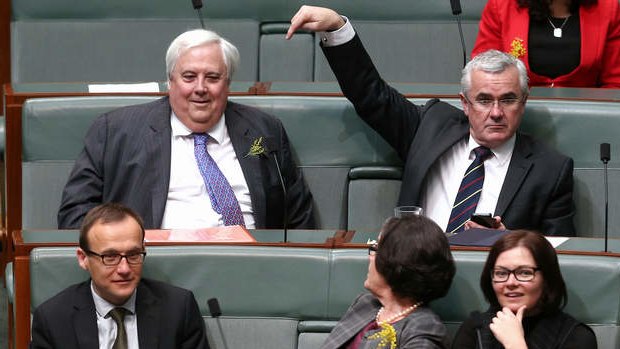 Independent MP Andrew Wilkie advises the tellers that Palmer United Party leader Clive Palmer has joined them for a division in the House of Representatives on Monday. Photo: Alex Ellinghausen