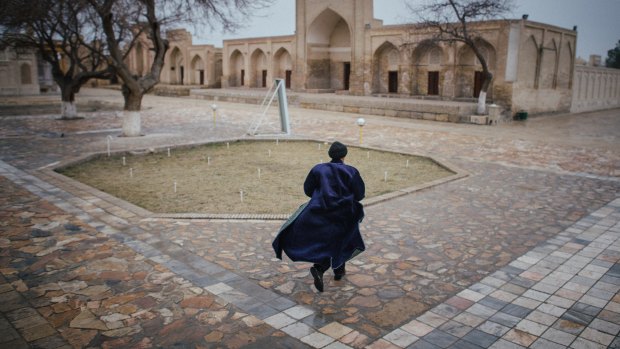 A man runs at Chor Bakr, near Bukhara, Uzbekistan. Bucking a global trend, Uzbekistan’s new leader is reining in the secret police, releasing political prisoners and allowing some freedom of expression. 