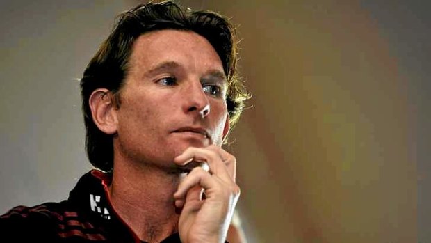 Essendon coach James Hird listens to the club's chairman, David Evans, at a press conference to hand down the findings of Dr Ziggy Switkowski's report.