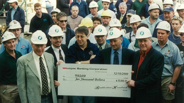 Donald McDonald, on left, raising funds and awareness of schizophrenia on a building site.