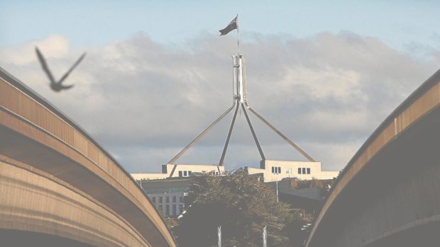 Parliament House, as seen through the centre of Commonwealth Bridge. 