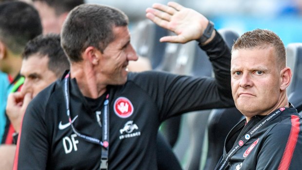 Under pressure: Gombau, right, needs results to secure his tenure at the Wanderers.